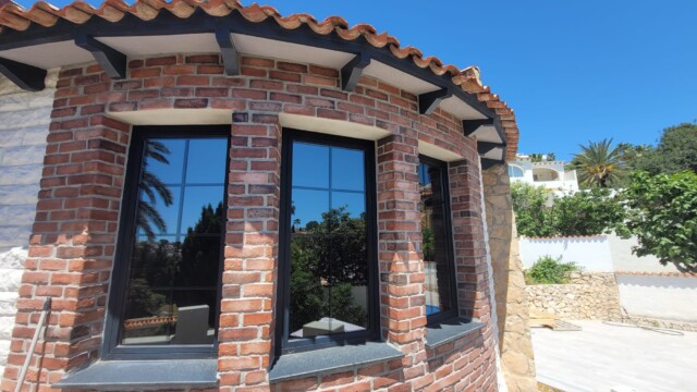 Installation of titanium solar window film in Benissa Alicante. Views from interior and exterior after installation