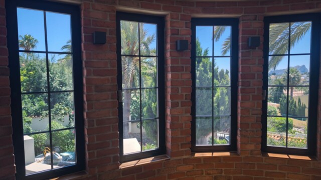 Installation of titanium solar window film in Benissa Alicante. Views from interior and exterior after installation