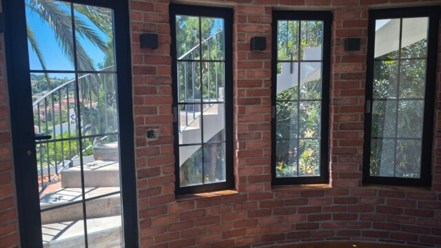 Installation of titanium solar window film in Benissa Alicante. Views from interior and exterior after installation