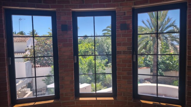 Installation of titanium solar window film in Benissa Alicante. Views from interior and exterior after installation